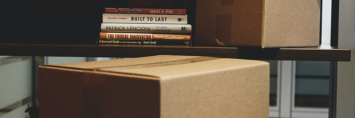 Homebound Delivery header showing boxes and a stack of books