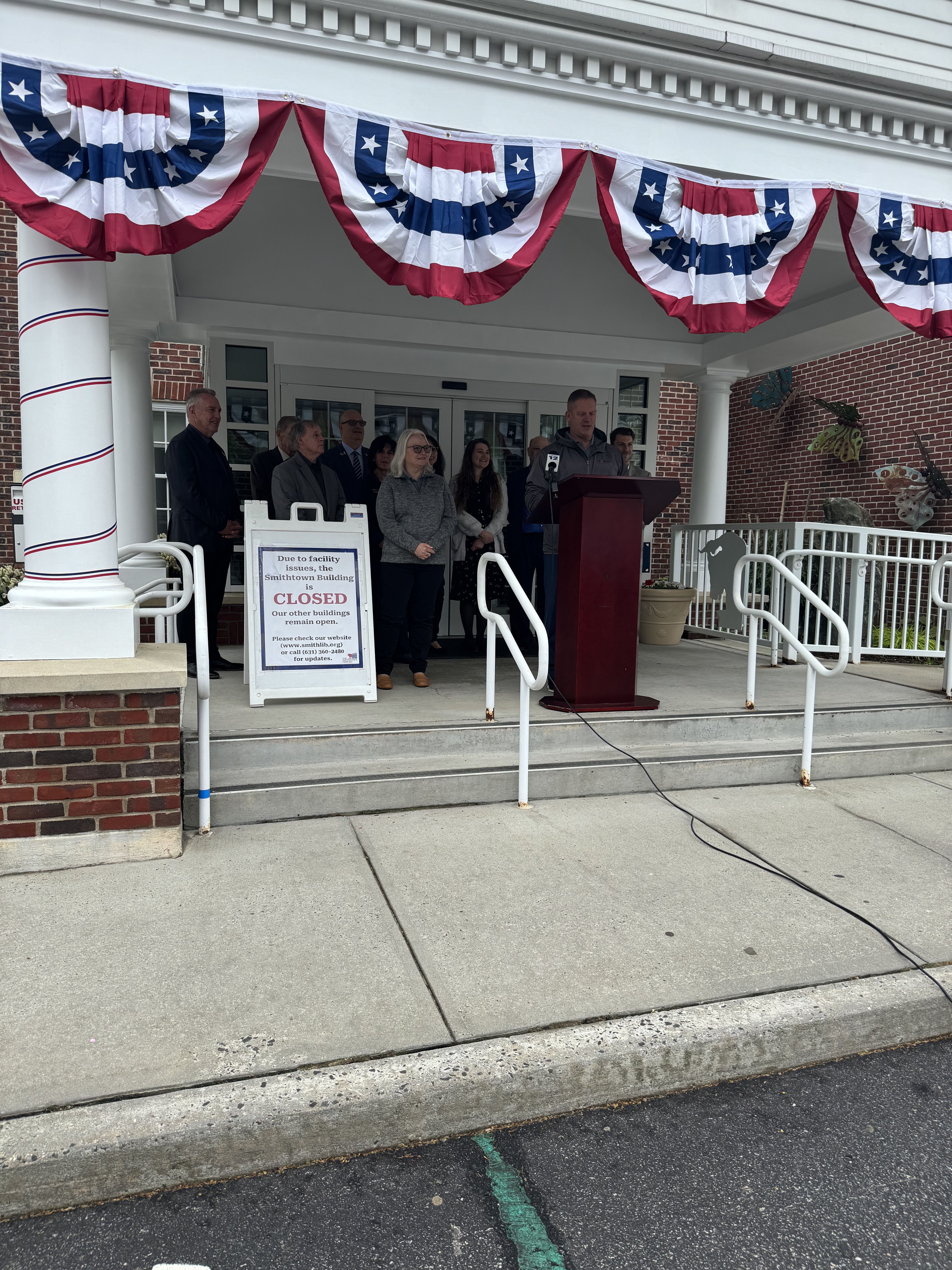 Library director addressing the crowd