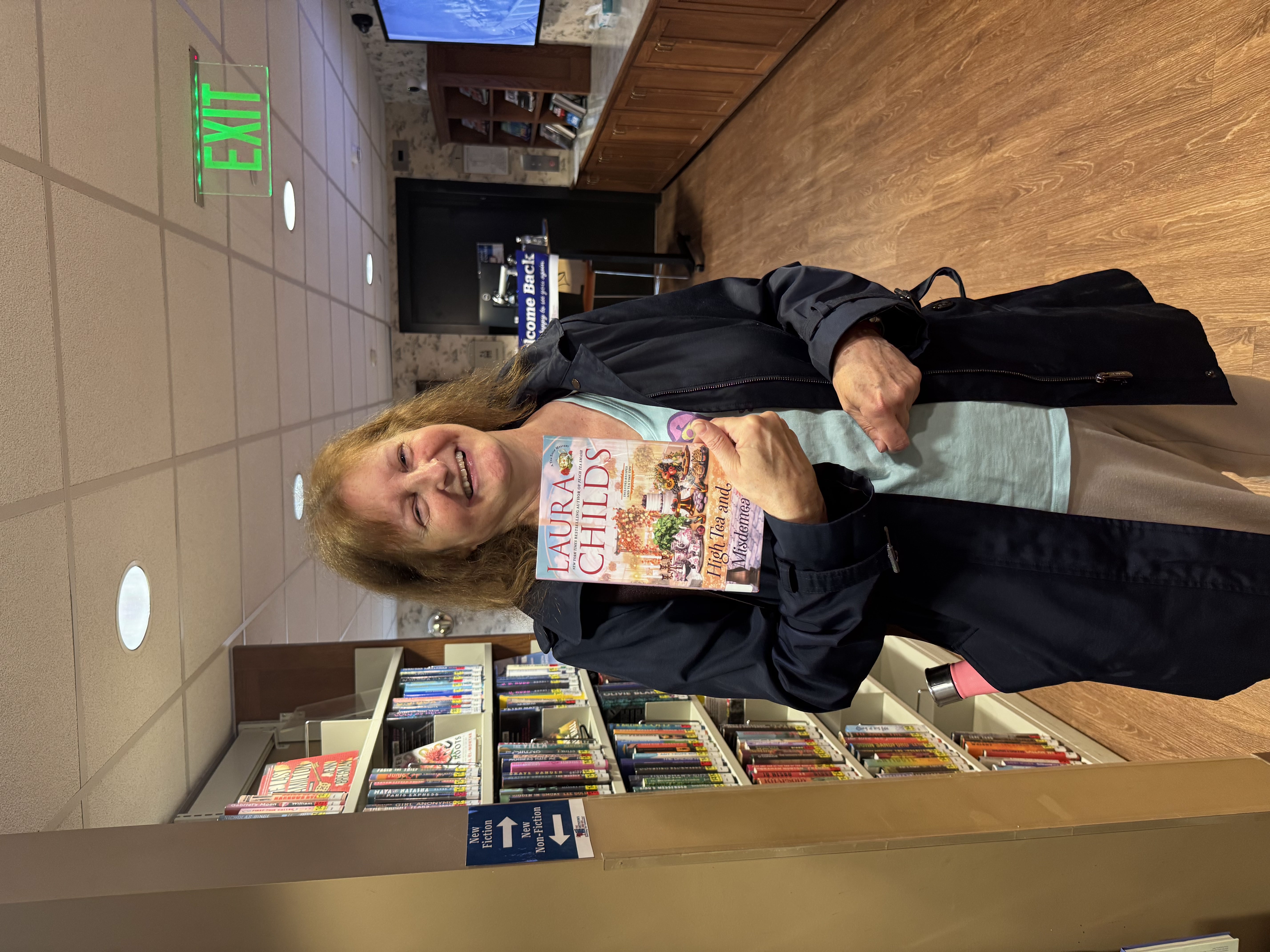 Female patron holding a library book