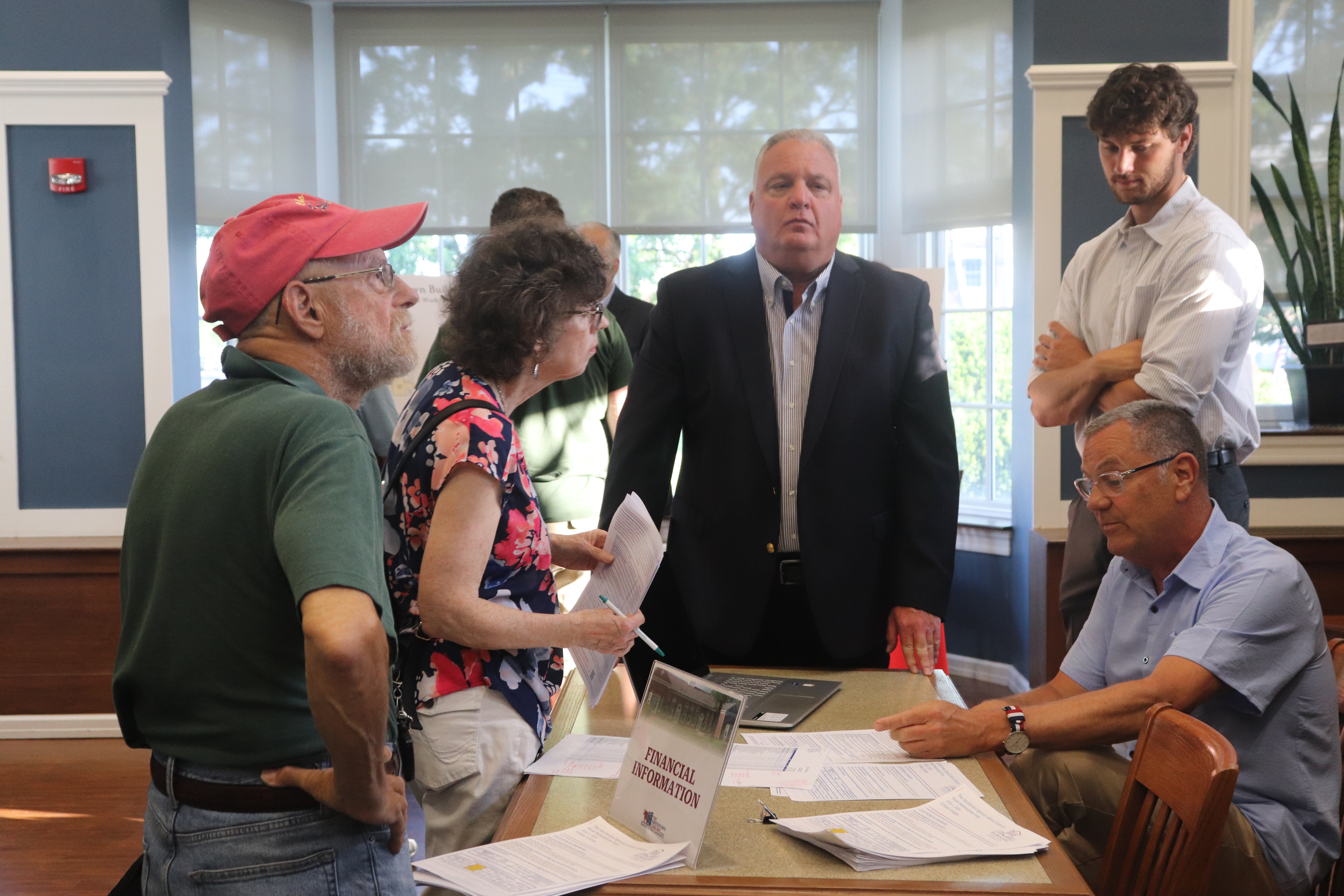 group of people at a table having a discussion