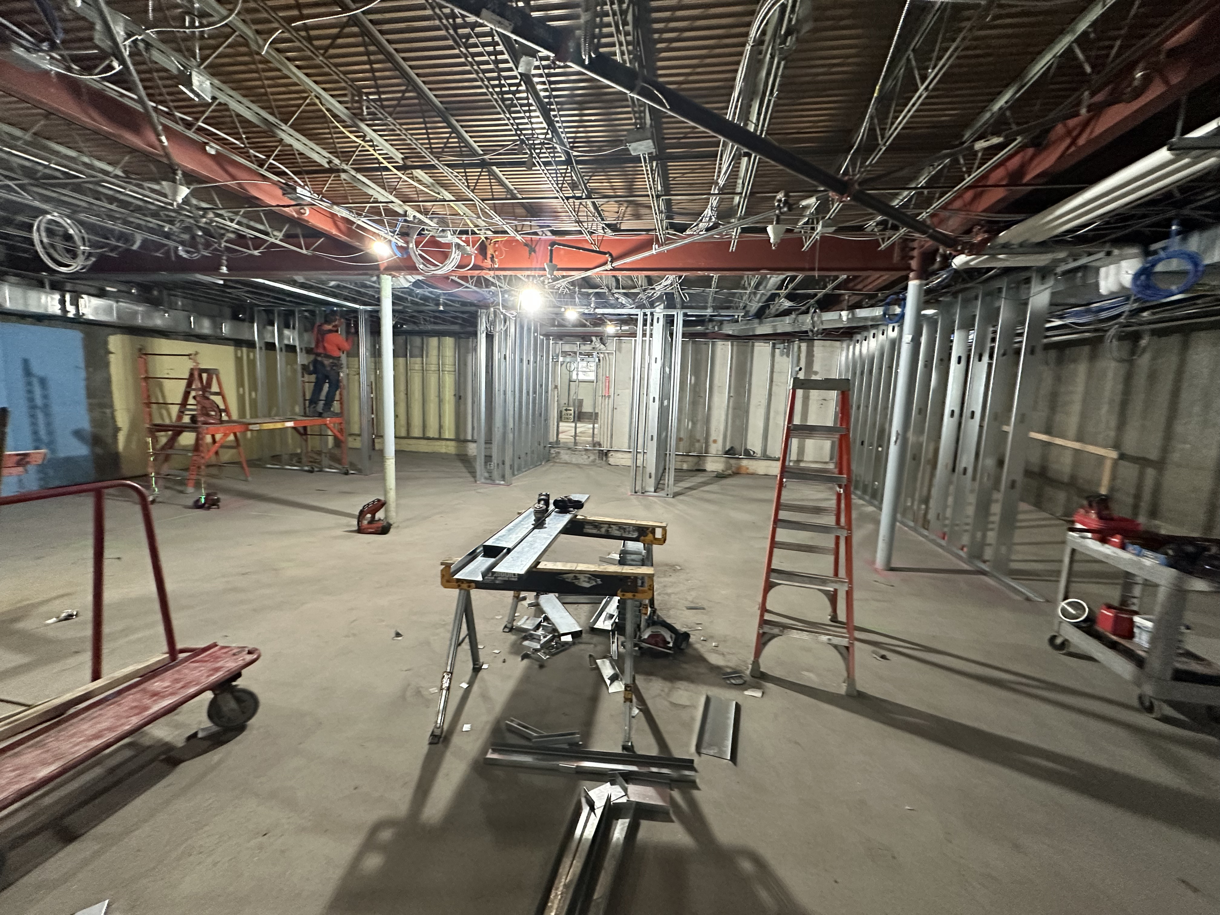 open basement with the starting of metal framing