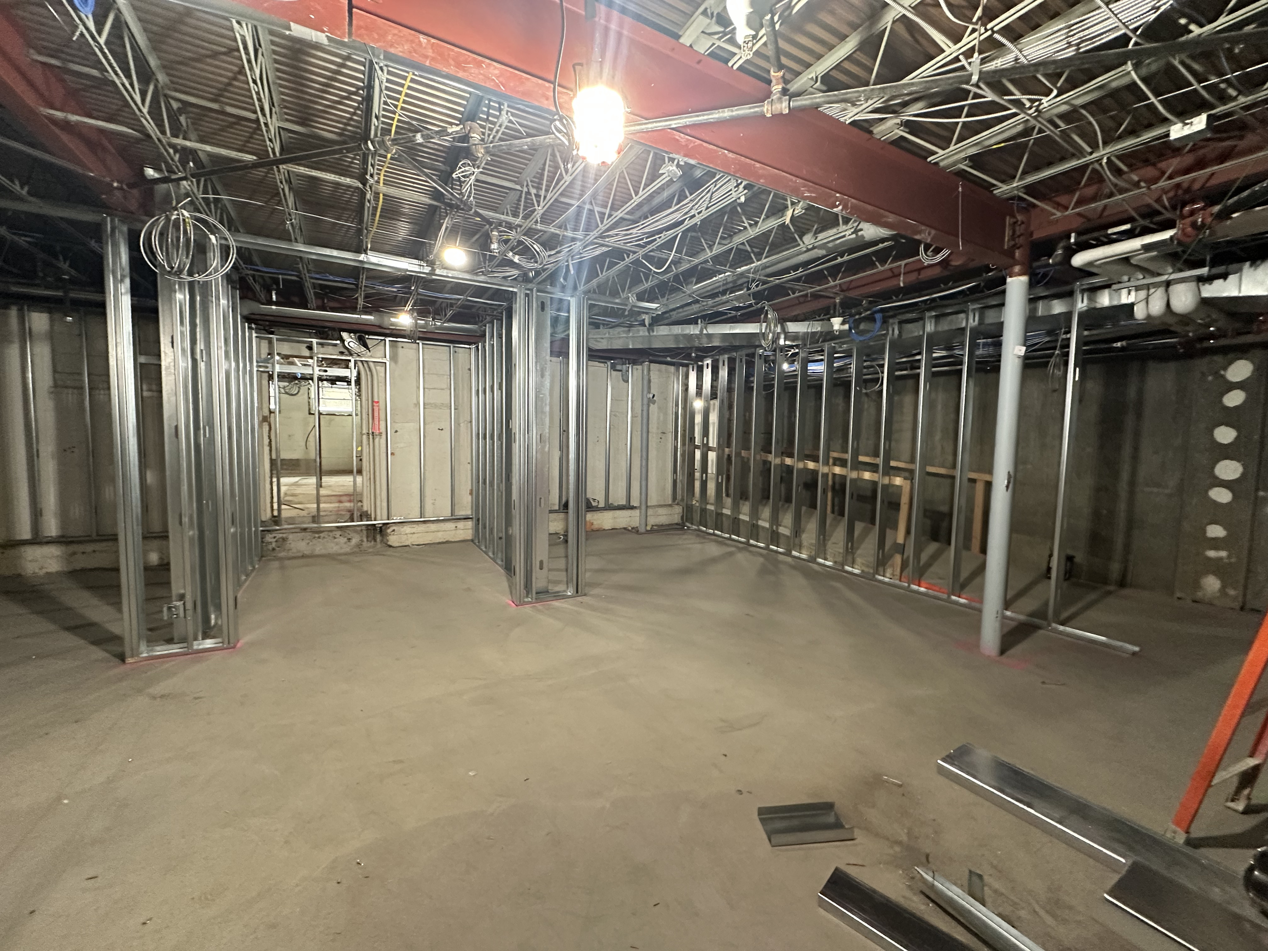 open basement with beginning framing