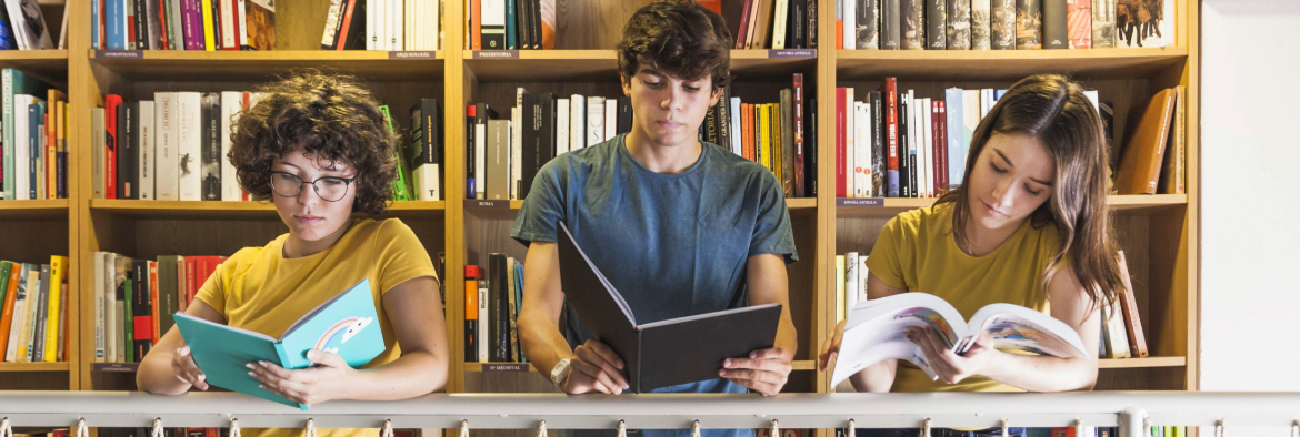 group of teens reading books