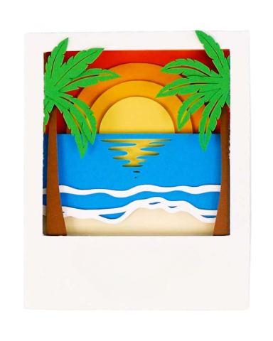 Image of a shadow box in a polaroid frame displaying a sunset surrounded by palm trees.